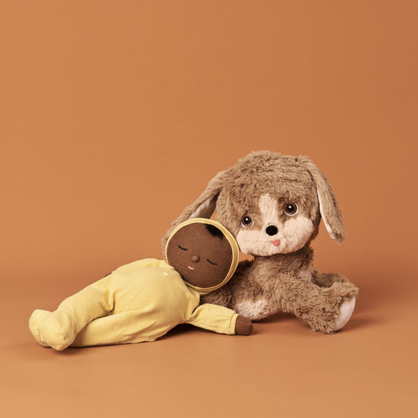 Posable soft plush dog toy with movable head and body parts.