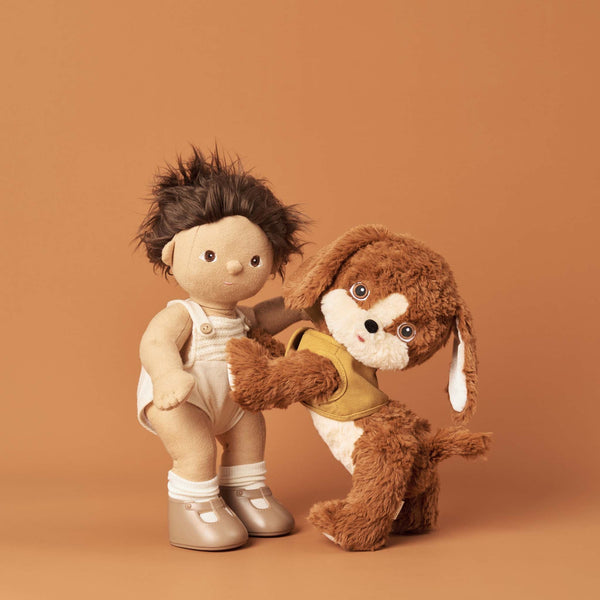 Posable soft plush dog toy with movable head and body parts.