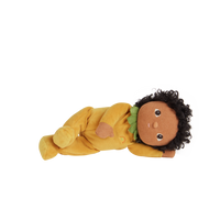 A limited-edition palm-sized plush toy, perfectly weighted in all the right places, and outfitted in a snuggly plush velvety pineapple suit.