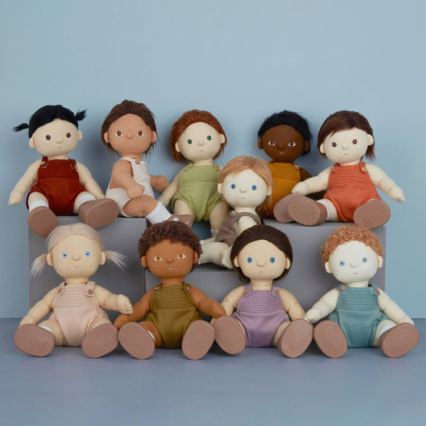 Gender-neutral, posable kids doll with brown hair and removable brown outfit. Dress them up and style their hair for hours of interactive kids play.