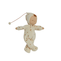 Beautiful plush doll, posable and perfectly weighted for calm. The Lullaby Lyra includes a pompom on their bonnet that plays a sleepy tune when pulled. This doll is suitable from birth.