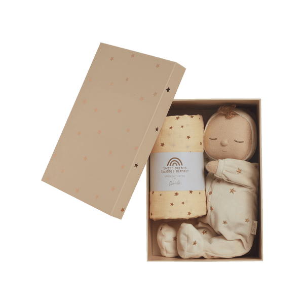 This gift set comes with a  posable plush doll and matching swaddle cloth. the Lullaby Lyra includes a pompom on their bonnet that plays a sleepy tune when pulled. Beautifully packaged in a keepsake box, this is the perfect gift for a newborn.