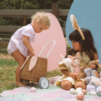 Woven rattan basket on wheels with printed lining. Perfectly sized for your kid to transport their favourite toys, dolls and treasures on their adventures. 