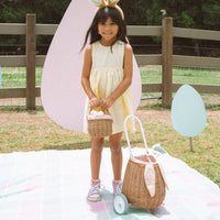 Rattan wheely basket with printed lining. Easter themed basket on wheels for kids to transport or store their favourite toys and treasures.