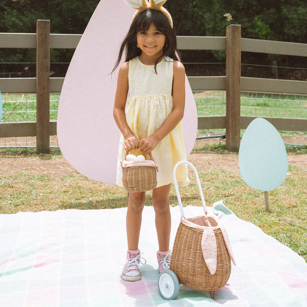 Rattan wheely basket with printed lining. Easter themed basket on wheels for kids to transport or store their favourite toys and treasures.