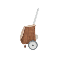 Woven rattan basket on wheels with printed lining. Perfectly sized for your kid to transport their favourite toys, dolls and treasures on their adventures. 