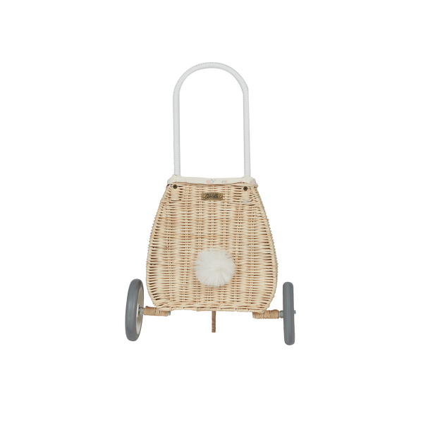 Woven rattan basket on wheels with printed flower lining. Perfectly sized for your kid to transport their favourite toys, dolls and treasures on their adventures. 