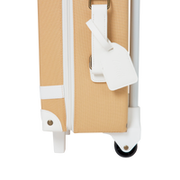 The ultimate kids travel suitcase. Yellow suitcase for kids holidays, with straps to carry their favourite doll / toy.