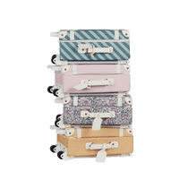Stylish kids travel suitcase in pink. Perfect for kids' travel, featuring a durable, lightweight build and eco-friendly materials. Made from recycled plastic bottles.