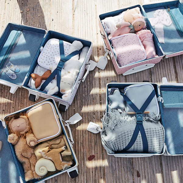 The ultimate kids travel suitcase. Blue suitcase for kids holidays, with straps to carry their favourite doll / toy.