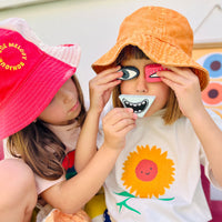 Tubbles Funspressions - Loopy Lucy by Olli Ella Kids sensory stones shown on children’s faces for imaginative expression play.